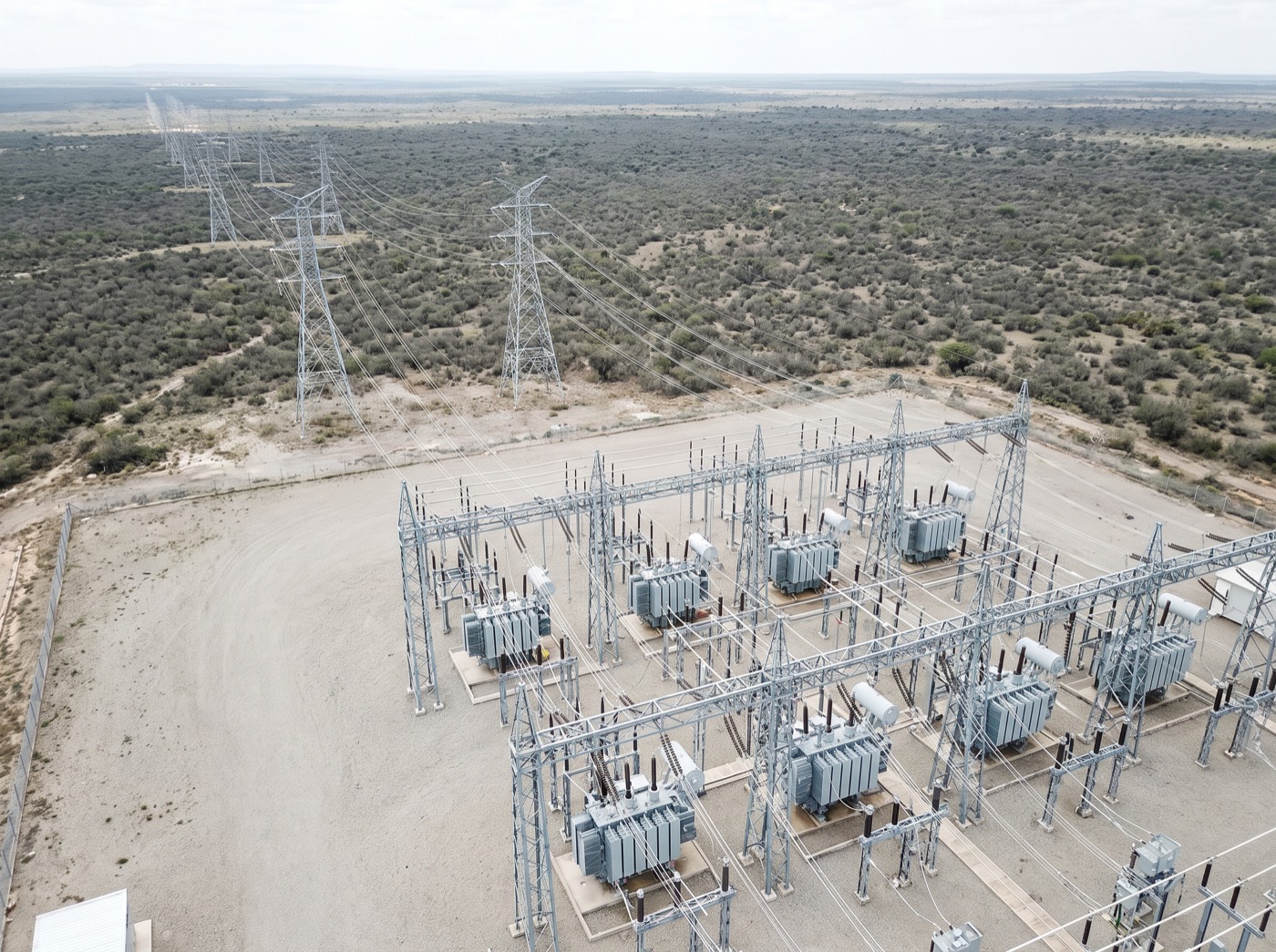 A high-voltage substation and transmission corridor running at capacity