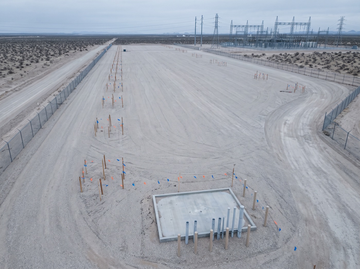 A prepared but unconnected industrial site beside a substation